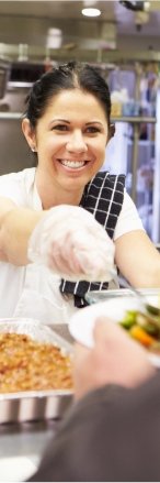 Atlantic Bay employee serves food at local homeless shelter